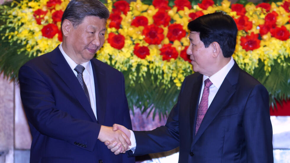 Vietnam's President Luong Cuong, right, and Chinese President Xi Jinping shake hands at the Presidential Palace in Hanoi, Vietnam, Tuesday, April 15, 2025. 