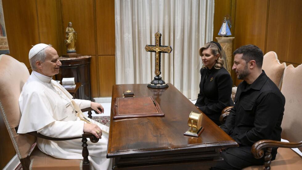 This photo taken and handout on 18 May 2025 by The Vatican Media shows Pope Leo XIV during a private audience with Ukraine's President Volodymyr Zelensky and his wife Olena Zelenska in The Vatican.
