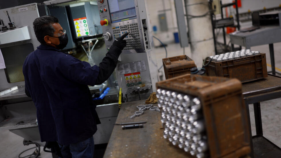 An employee works at a factory that manufactures parts with aluminum and steel and exports its products to the United States, as U.S. President Donald Trump ordered 25% tariffs on aluminum and steel i