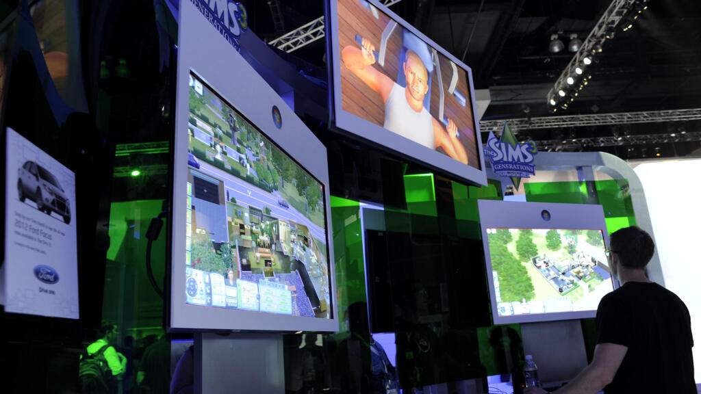 Sur cette photo d'archive prise le 9 juin 2011, des joueurs jouent au jeu vidéo « Sims » lors du salon Electronic Entertainment Expo (E3) à Los Angeles, en Californie (image d'illustration).