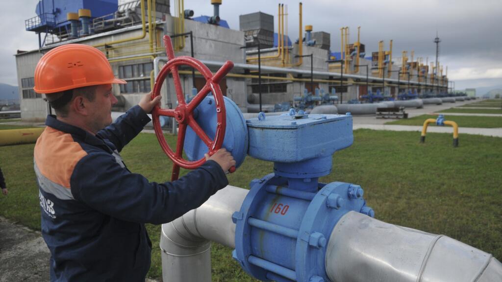 In this Wednesday, Oct. 7, 2015 file photo, a worker at a Ukrainian gas station Volovets in western Ukraine controls a valve.