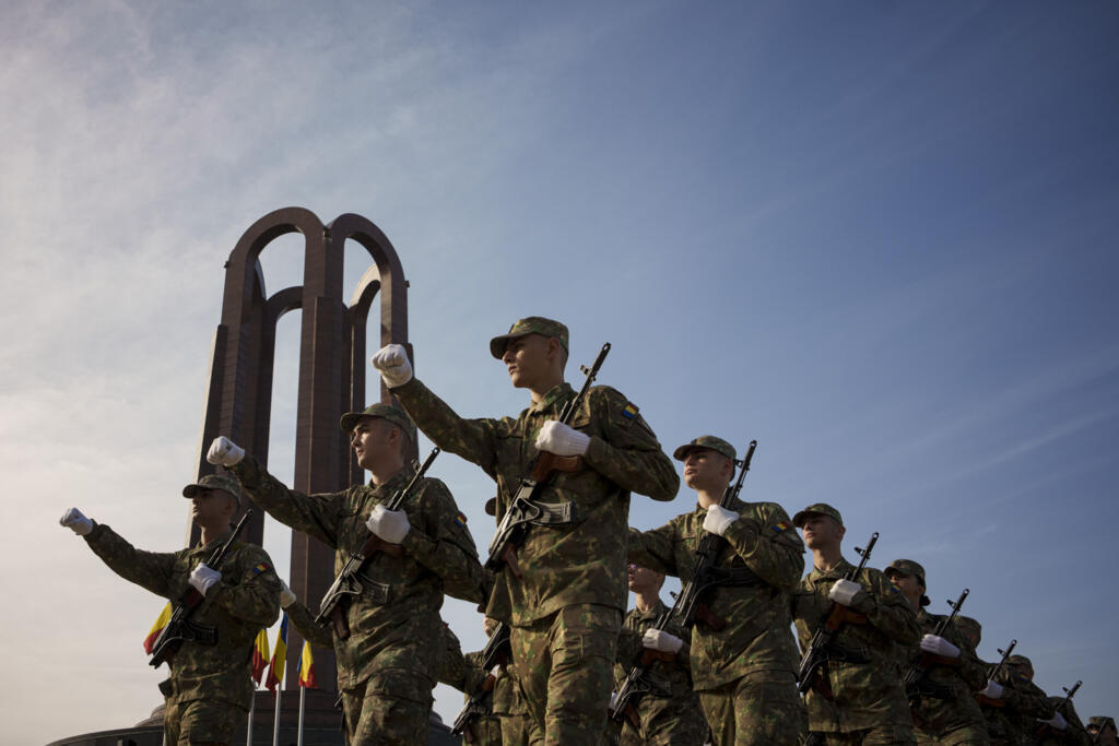 Military cadets march by the Unknown Soldier monument after a swearing in ceremony on Romanian Army Day in Bucharest, 25 October, 2023.