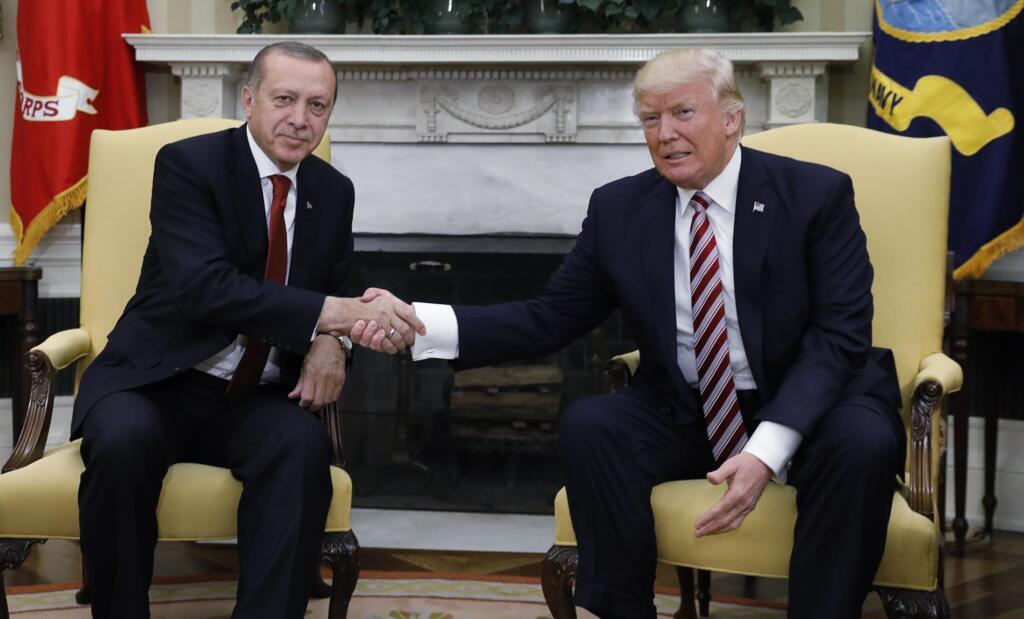 Turkey's President Recep Tayyip Erdogan shakes hands with US President Donald Trump in the Oval Office of the White House on 16 May 2017.