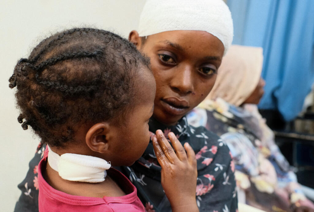 A woman and her daughter are treated at a hospital following a drone strike, in Atbara, River Nile State, Sudan, on 25 April 2025.