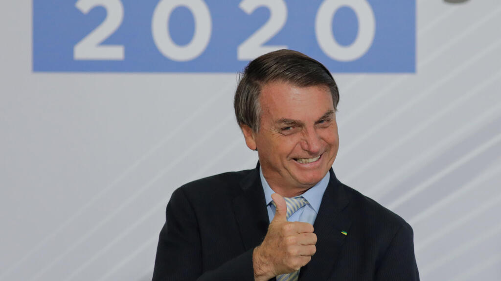 O presidente Jair Bolsonaro sorri durante um ato celebrado em 9 de dezembro de 2020 em Brasilia.