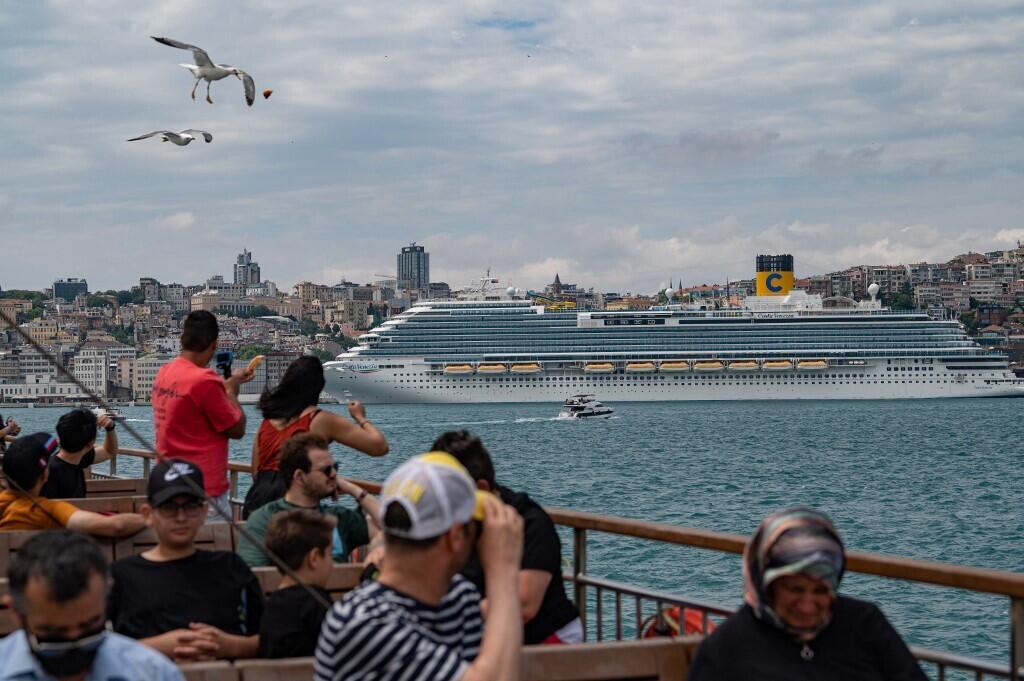 Bystanders watch a Costa cruise ship in Galataport, Istanbul, on 6 June 2022.