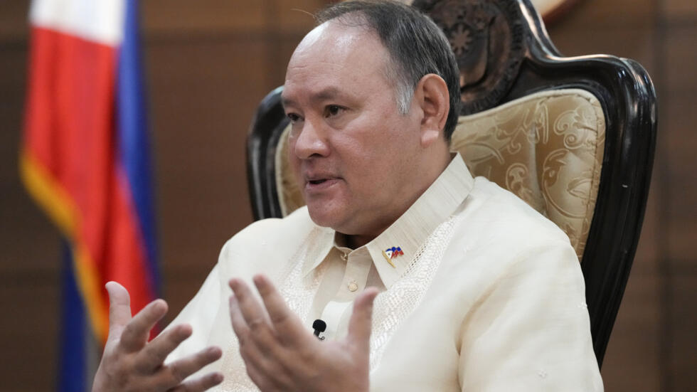 Philippine Defense Secretary Gilberto Teodoro gestures as he answers questions during an interview with the Associated Press at the Department of National Defense headquarters in Quezon city, Philippi